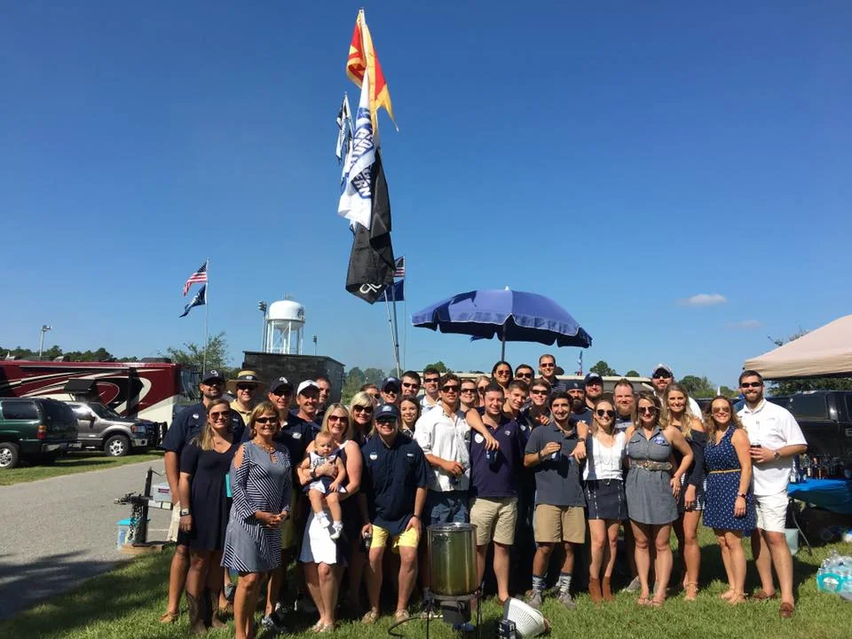 Delta Chi alumni and undergraduates at a homecoming gathering